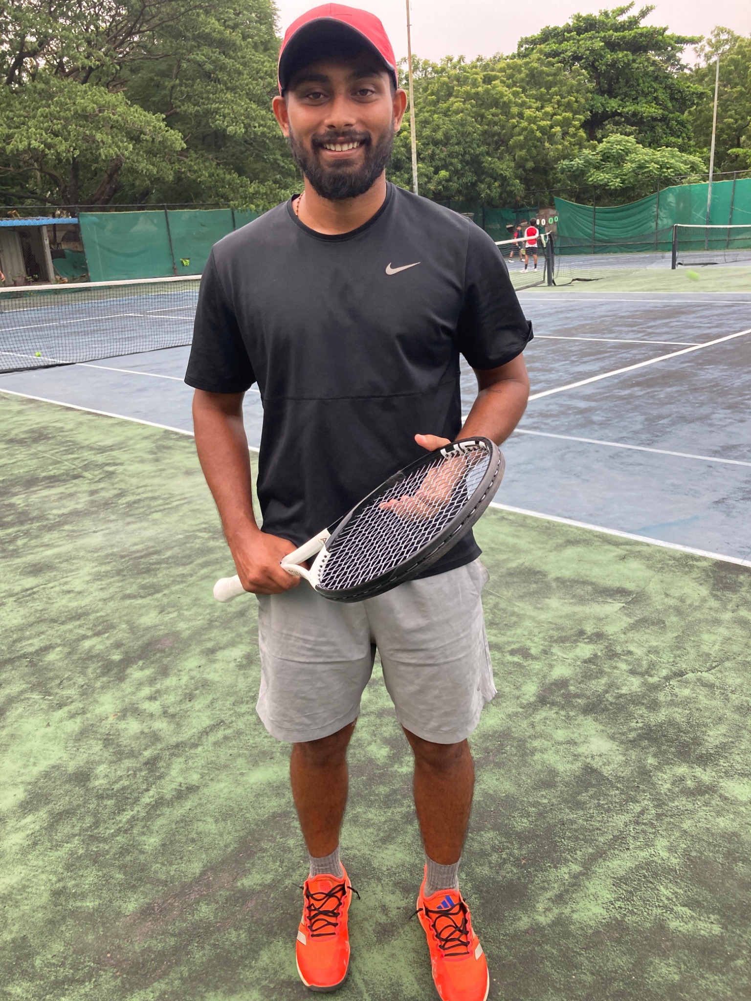 Akash Daniel on a tennis court